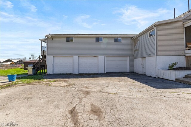 view of side of property with a garage