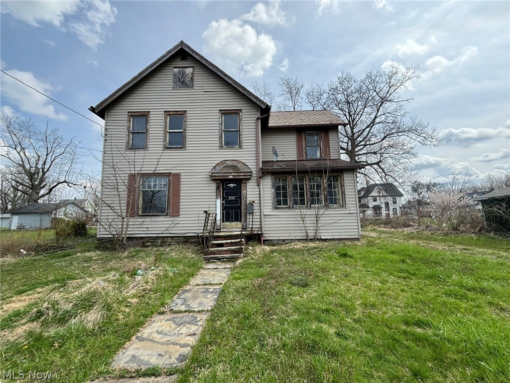 view of front property with a front lawn