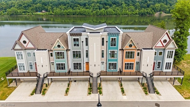 view of front of property featuring a water view and a garage