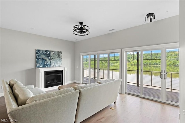 living room with light hardwood / wood-style flooring