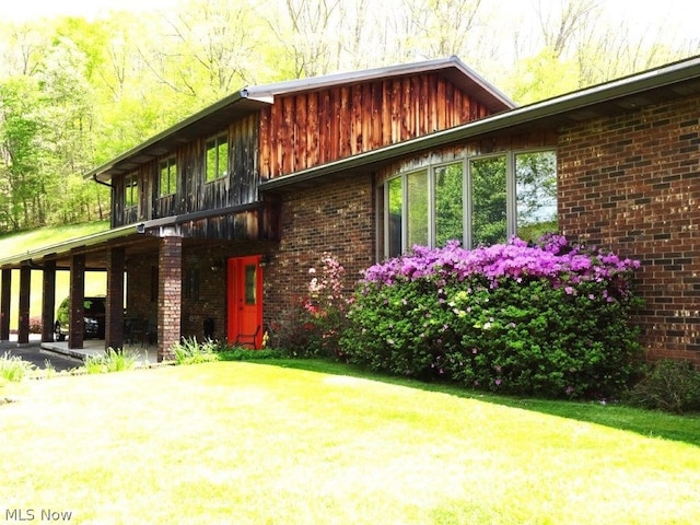 11421 Clay Rd, Newton, WV 25266 - view of front of home featuring brick siding and a front lawn
