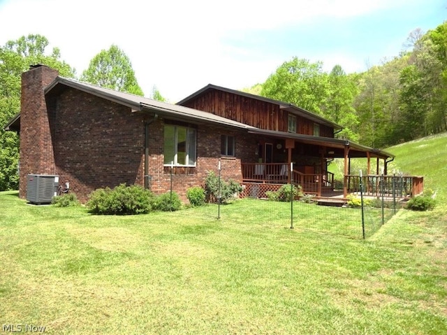 11421 Clay Rd, Newton, WV 25266 - rear view of house featuring a lawn, a chimney, and cooling unit