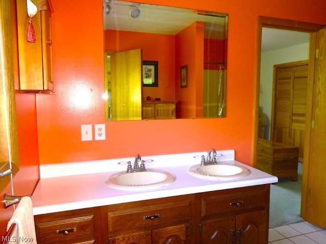11421 Clay Rd, Newton, WV 25266 - bathroom featuring a sink, tile patterned floors, and double vanity