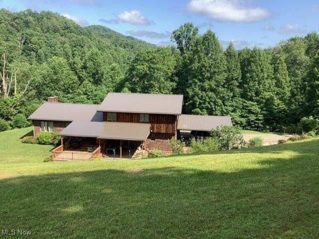 11421 Clay Rd, Newton, WV 25266 - rear view of property with a lawn and a view of trees