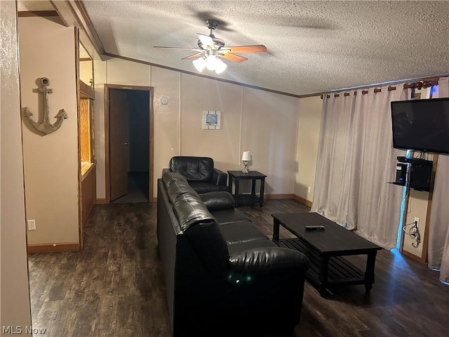 living room featuring dark hardwood / wood-style flooring, a textured ceiling, ceiling fan, crown molding, and lofted ceiling