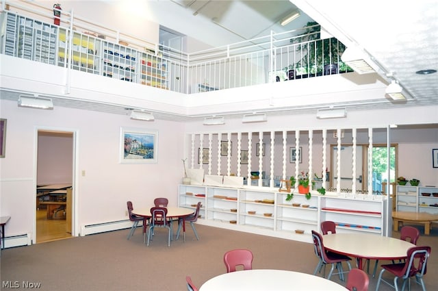 interior space featuring a baseboard radiator and carpet floors