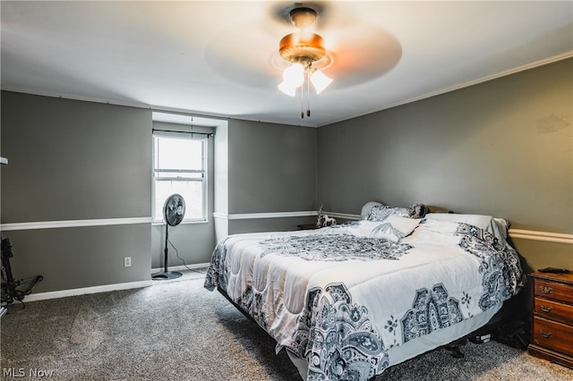 carpeted bedroom featuring ornamental molding and ceiling fan