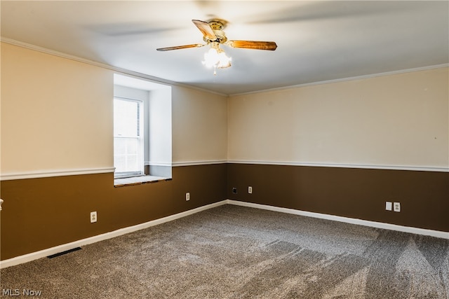 spare room featuring ceiling fan, crown molding, and carpet floors