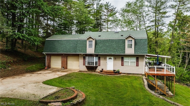 view of front of home with a garage and a front yard