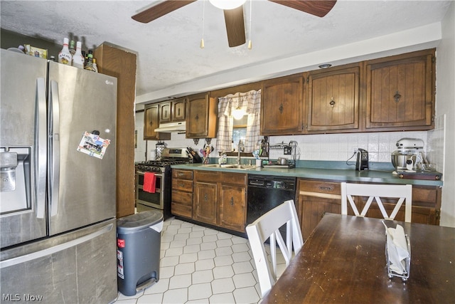 kitchen featuring appliances with stainless steel finishes, backsplash, ceiling fan, sink, and light tile floors