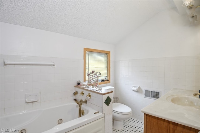 bathroom featuring vanity, tile walls, toilet, a textured ceiling, and lofted ceiling