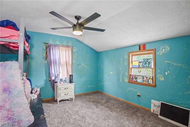 bedroom featuring vaulted ceiling, ceiling fan, a textured ceiling, and carpet flooring