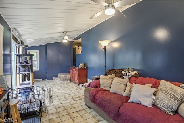 tiled home theater featuring lofted ceiling and ceiling fan