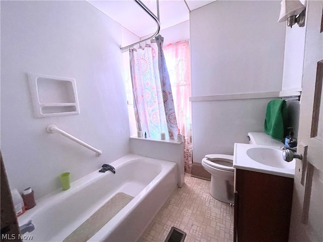 bathroom with tile flooring, vanity, and toilet