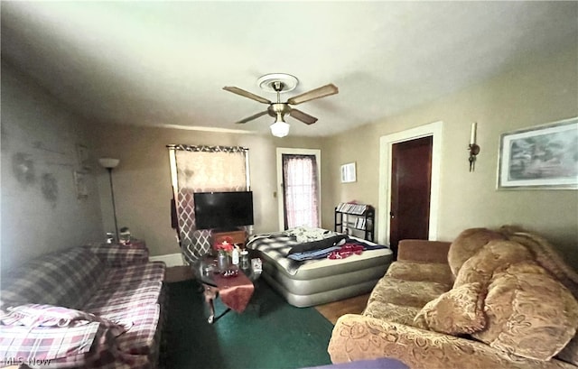 living room featuring ceiling fan