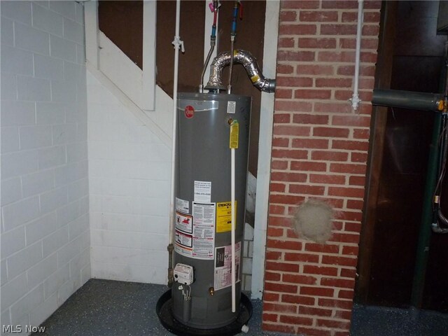 utility room featuring gas water heater