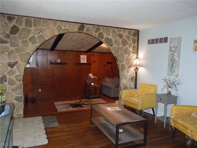 living room featuring wood walls and hardwood / wood-style flooring