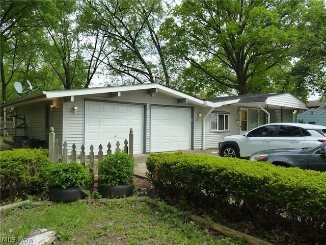 view of side of property with a garage