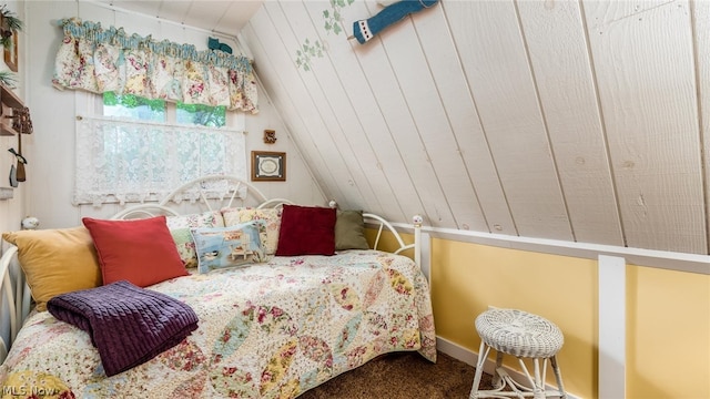 bedroom with lofted ceiling and carpet