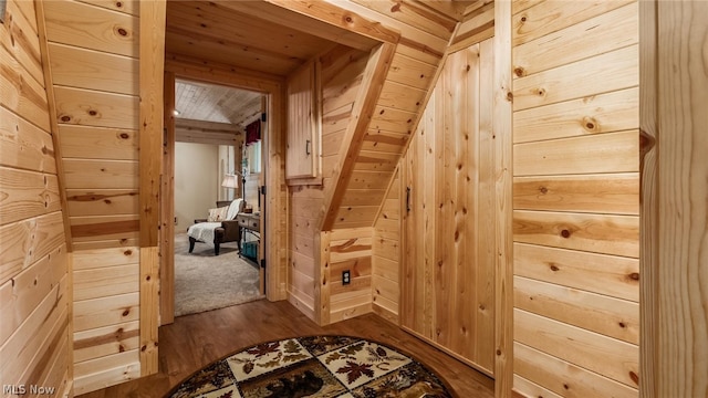 interior space with wooden ceiling, wood walls, and hardwood / wood-style flooring