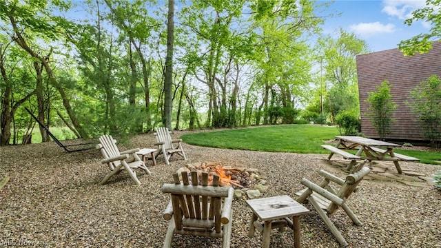 view of yard with a fire pit