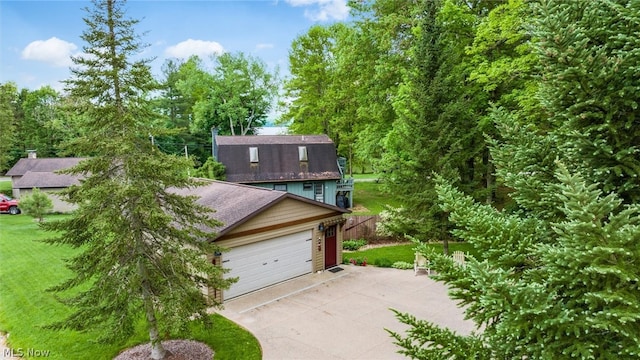 view of front of house with a garage and a front yard