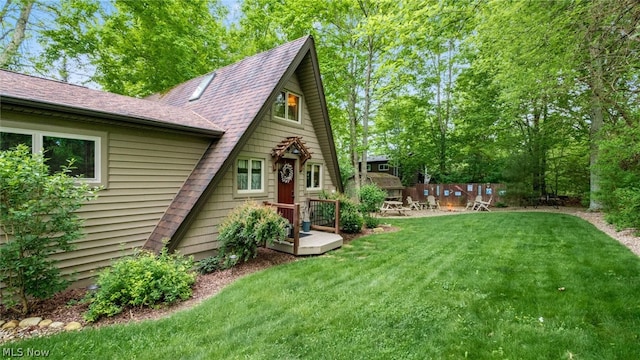 view of yard featuring a wooden deck