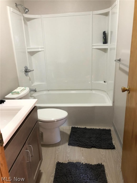 full bathroom with shower / tub combination, vanity, and toilet