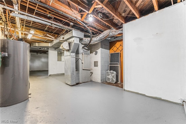 basement featuring water heater and heating unit