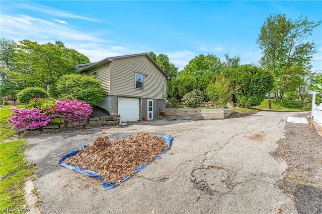 view of home's exterior featuring a garage