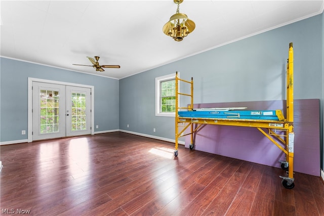 bedroom featuring french doors, crown molding, dark hardwood / wood-style flooring, and access to outside