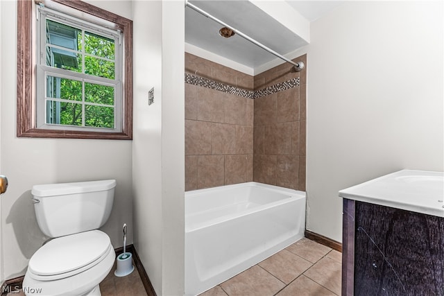 full bathroom with toilet, tiled shower / bath combo, vanity, and tile patterned flooring