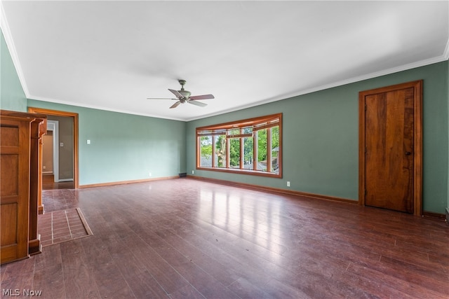 empty room with ceiling fan, dark hardwood / wood-style floors, and crown molding