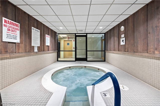 view of swimming pool featuring an indoor in ground hot tub