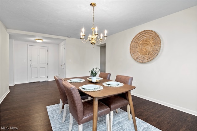 dining area with a chandelier and dark hardwood / wood-style floors