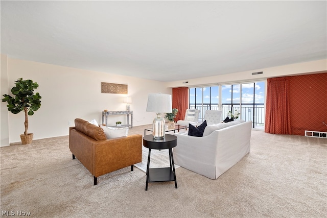 living room featuring light carpet