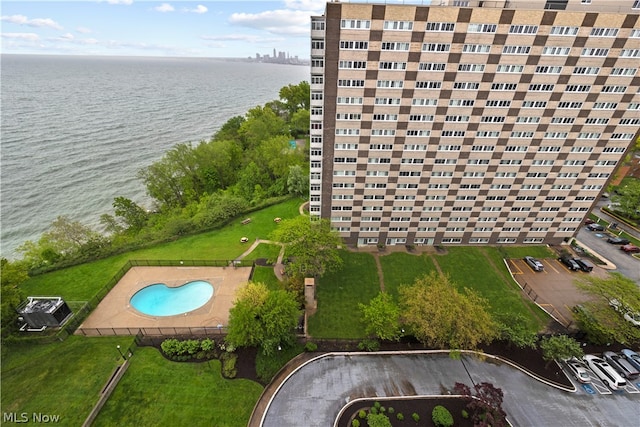 birds eye view of property featuring a water view