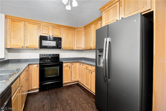 kitchen with a textured ceiling, dark wood-type flooring, black appliances, sink, and light brown cabinetry