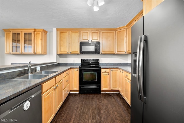 kitchen with a textured ceiling, dark hardwood / wood-style flooring, black appliances, sink, and light brown cabinets