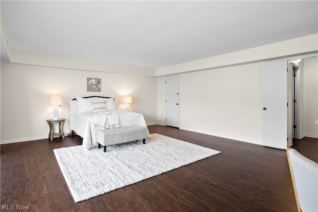 bedroom featuring dark hardwood / wood-style floors