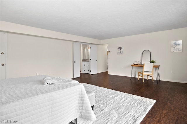 bedroom featuring dark wood-type flooring