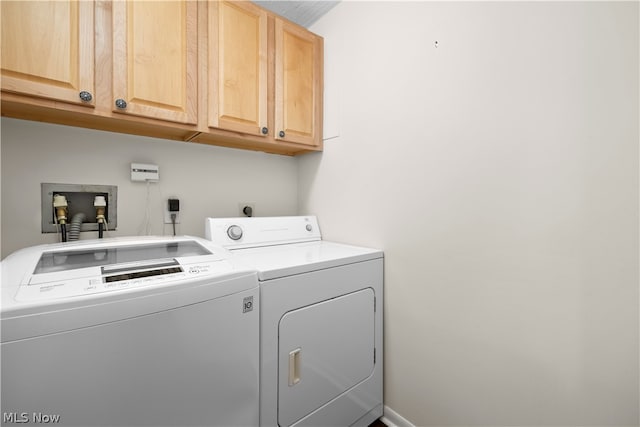 washroom featuring cabinets, washer hookup, independent washer and dryer, and hookup for an electric dryer