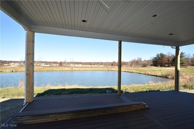 dock area featuring a deck with water view