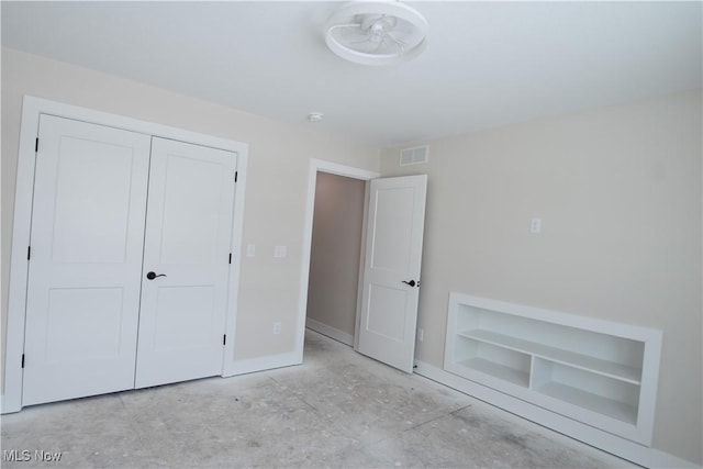 unfurnished bedroom with a closet