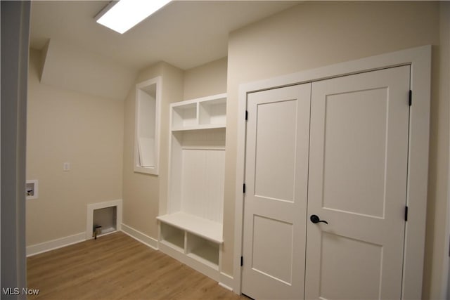 mudroom with light wood-type flooring and baseboards