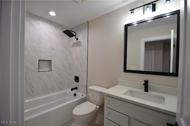 full bathroom featuring toilet, shower / bathing tub combination, and vanity