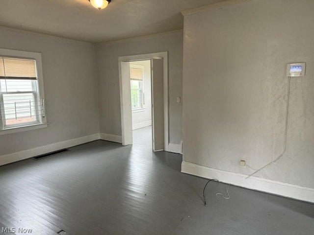 spare room featuring dark hardwood / wood-style floors