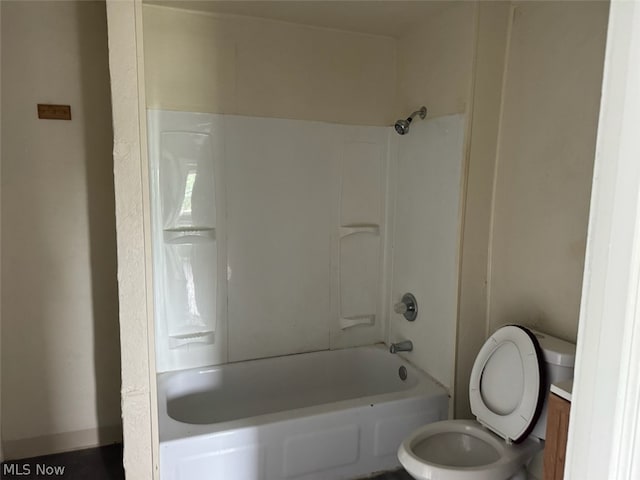 bathroom with shower / tub combination and toilet