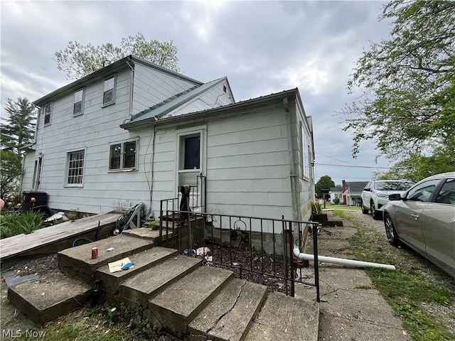 back of property with metal roof