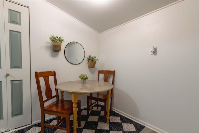 dining room with lofted ceiling